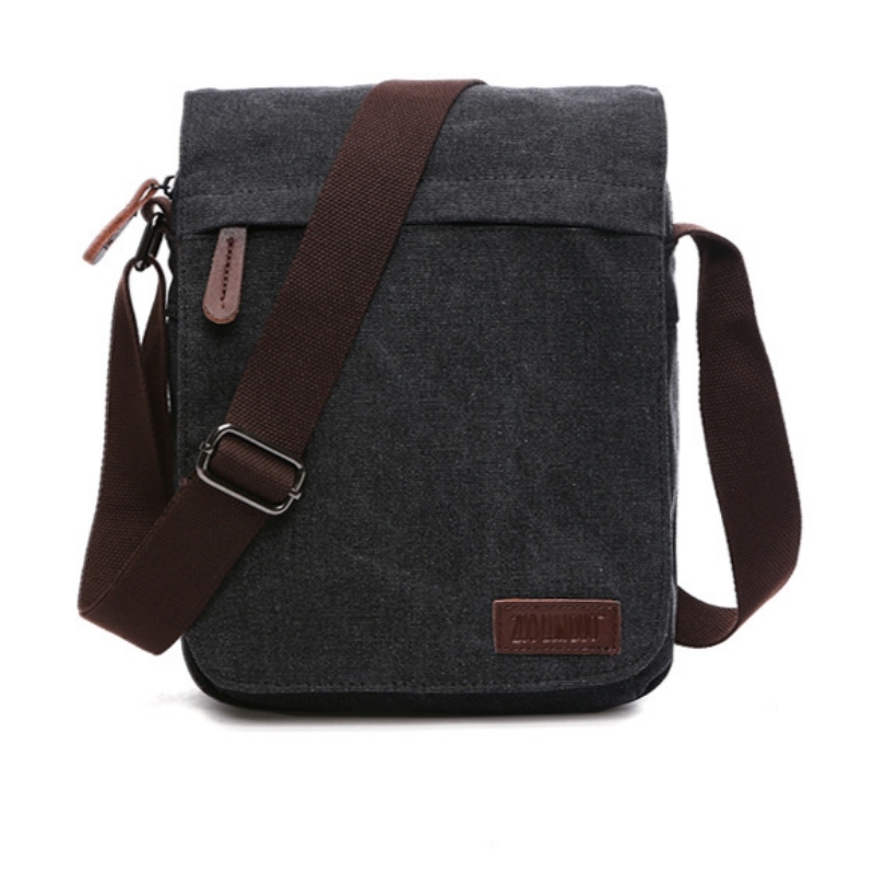 Sporty crossbody-taske i kanvas og læder Sort | Elgiganten | Elgiganten
